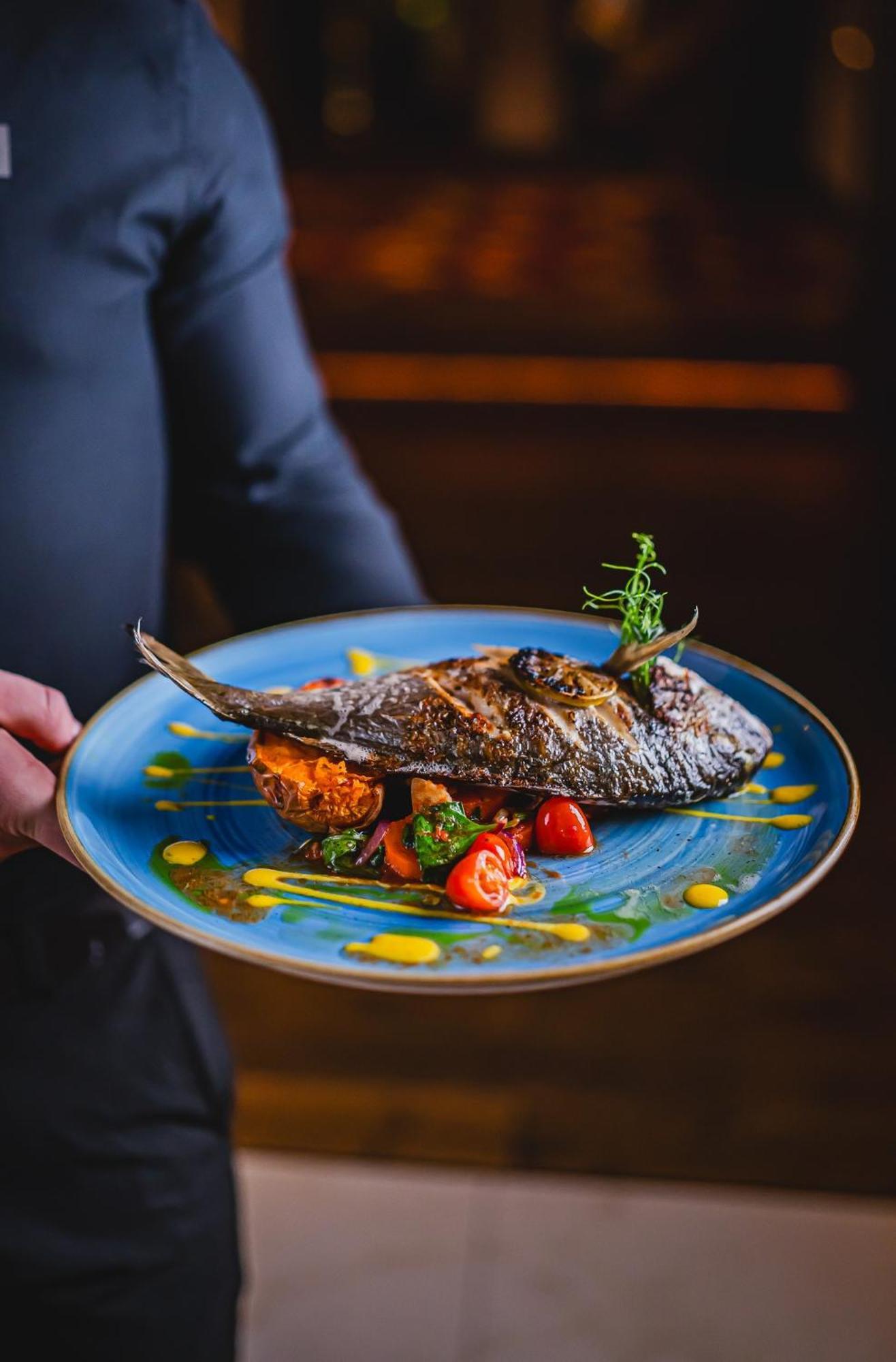 Hotel Bristol Tradition And Luxury Rzeszów Kültér fotó A prepared fish